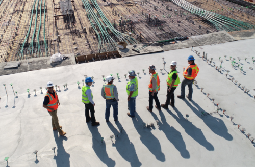 Group of engineers looking over a building project